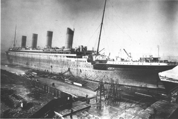 The Titanic in her Belfast dry-dock, Feb 3, 1912. Her propellers are being fitted and a final coat of paint applied. From "Titanic - An Illustrated History"